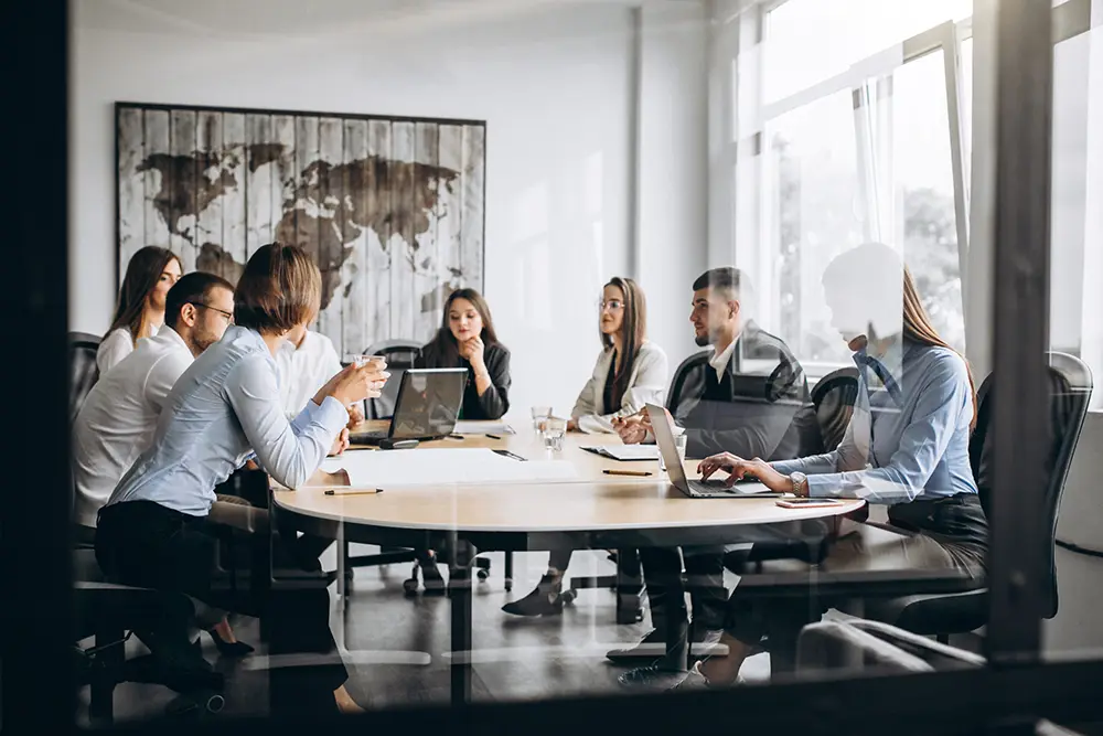 group-people-working-out-business-plan-office-scaled copy